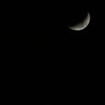 Stunning crescent moon set against a vast, dark night sky, perfect for celestial themes.