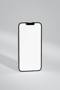 A close-up of a modern smartphone with a blank screen, ideal for mockups and design displays.